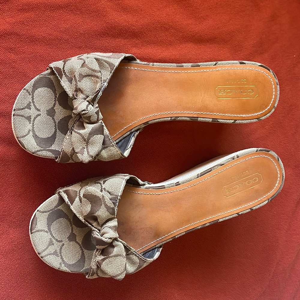 Coach 11 M Signature 3 1/4” wedge sandal. Cloth bow leather insole.
